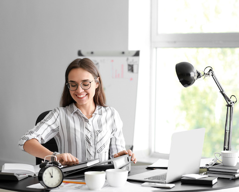 Happy businesswoman finishing her job in time